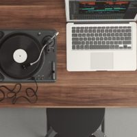 A laptop and a record player